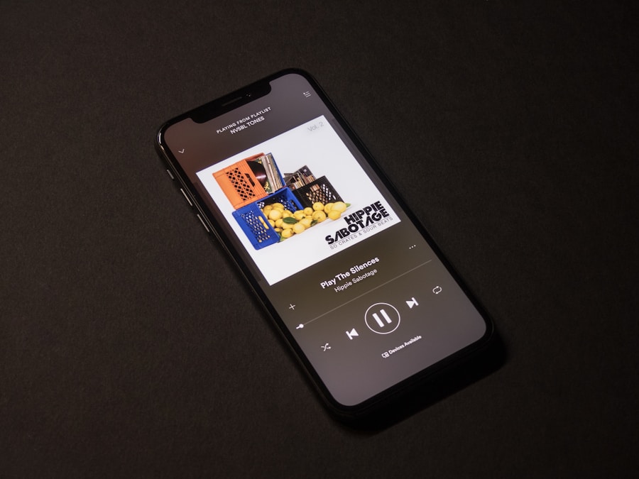 Image-5 shows a smartphone on a dark surface with a music streaming app open, playing "Pay for the Silences" by Hippie Sabotage. The screen displays the album art and media controls.