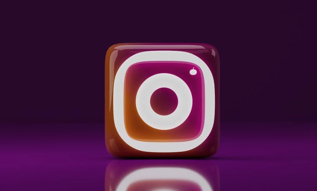 Product image-10 features a 3D glossy Instagram logo icon with a pink, orange, and purple gradient, centered on a reflective surface against a dark purple background.